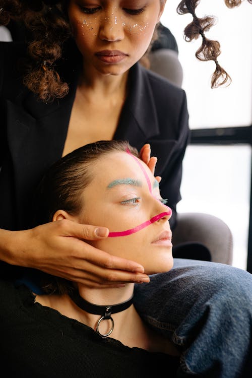 Woman in Black Blazer Showing the Face of Woman with Creative Makeup