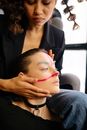 Woman in Black Blazer Showing the Face of Woman with Creative Makeup