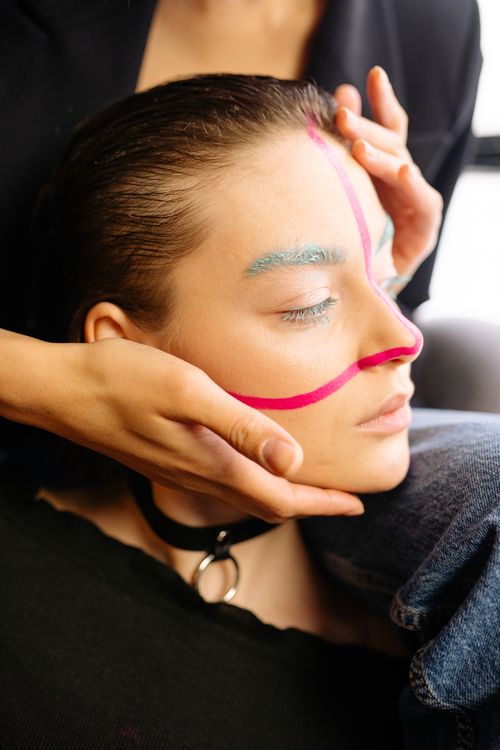Free Close-up portrait highlighting bold face paint and a stylish choker. Stock Photo
