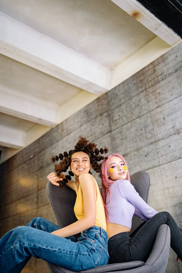 Beautiful Women Sitting On An Armchair