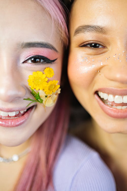 Smiling Woman With Yellow Flower on Her Cheek