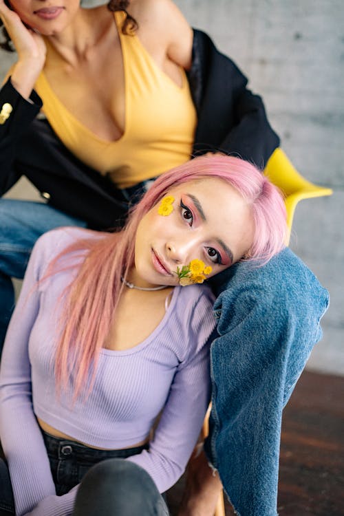 A Woman in Purple Long Sleeves and Pink Hair