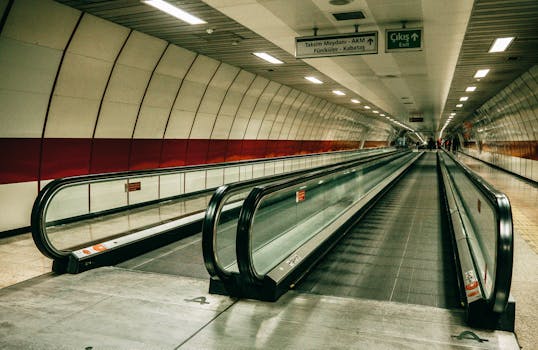 Interior view of Taksim metro station walkway in Istanbul, showcasing modern architecture and perspective.