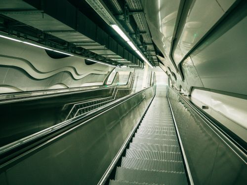 Free High-angle view of a sleek escalator in a futuristic Istanbul subway station, featuring modern design elements. Stock Photo