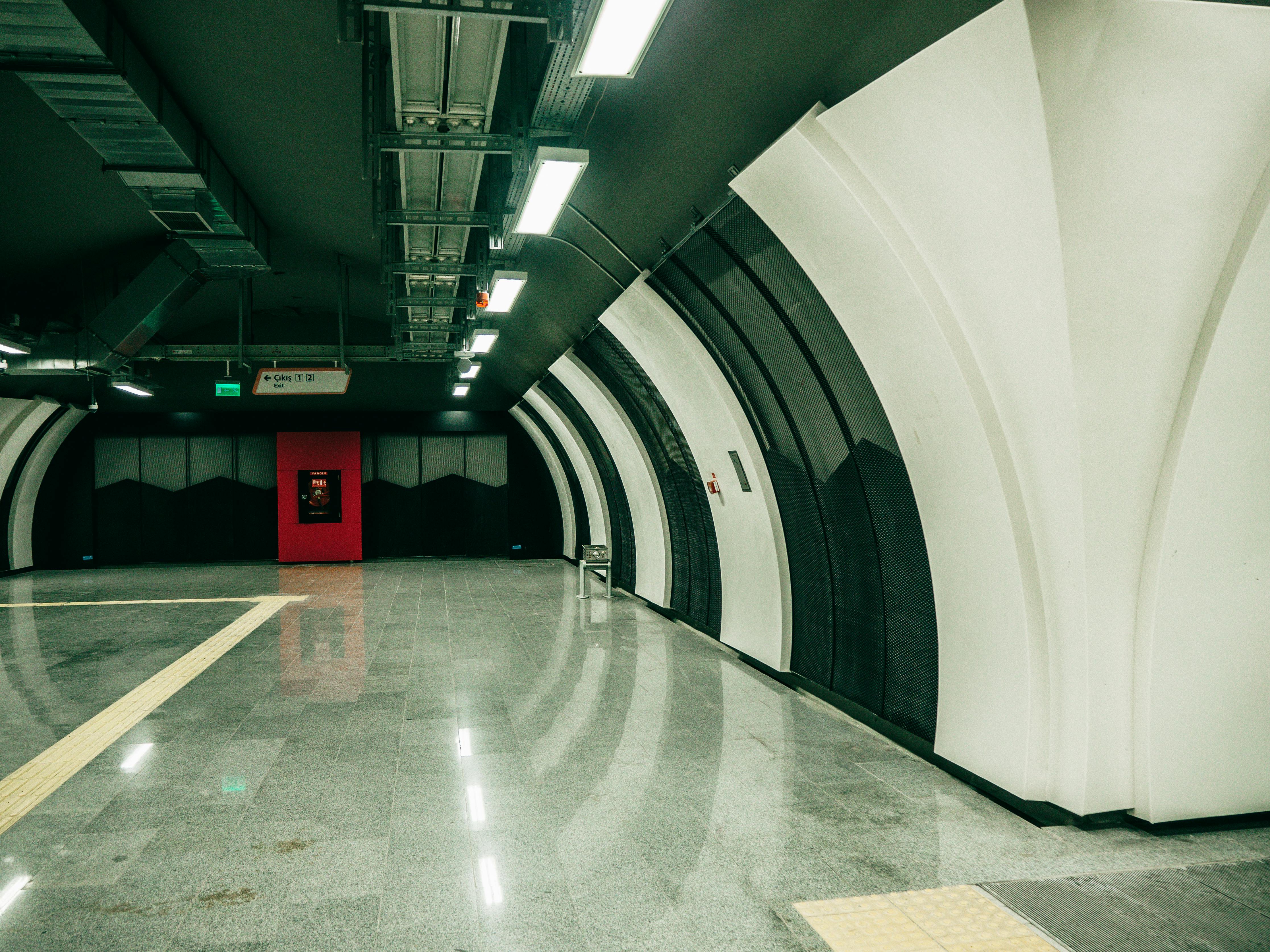 Explore the sleek and modern design of an empty Istanbul subway station with polished floors and futuristic lighting.