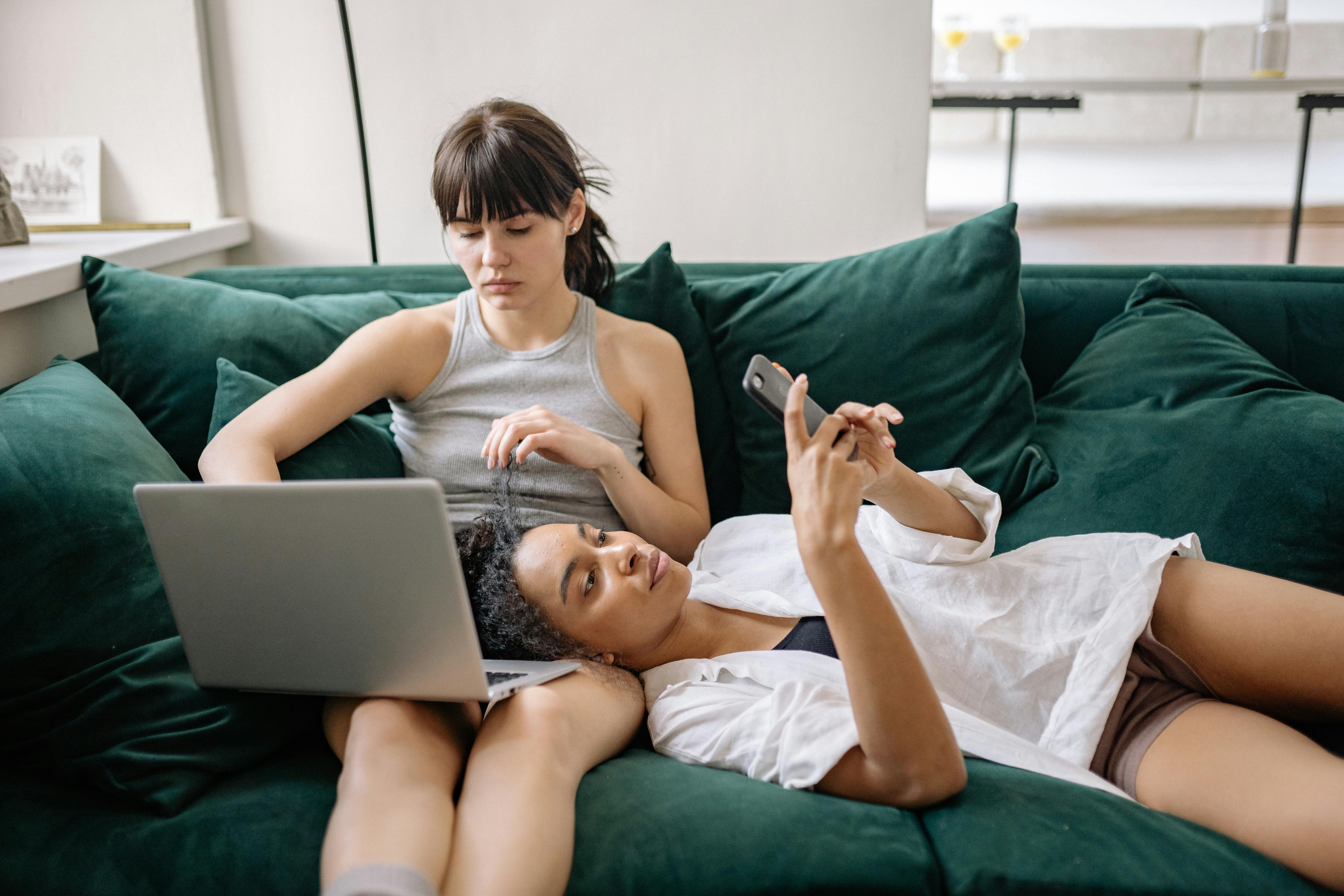 women sitting on the couch