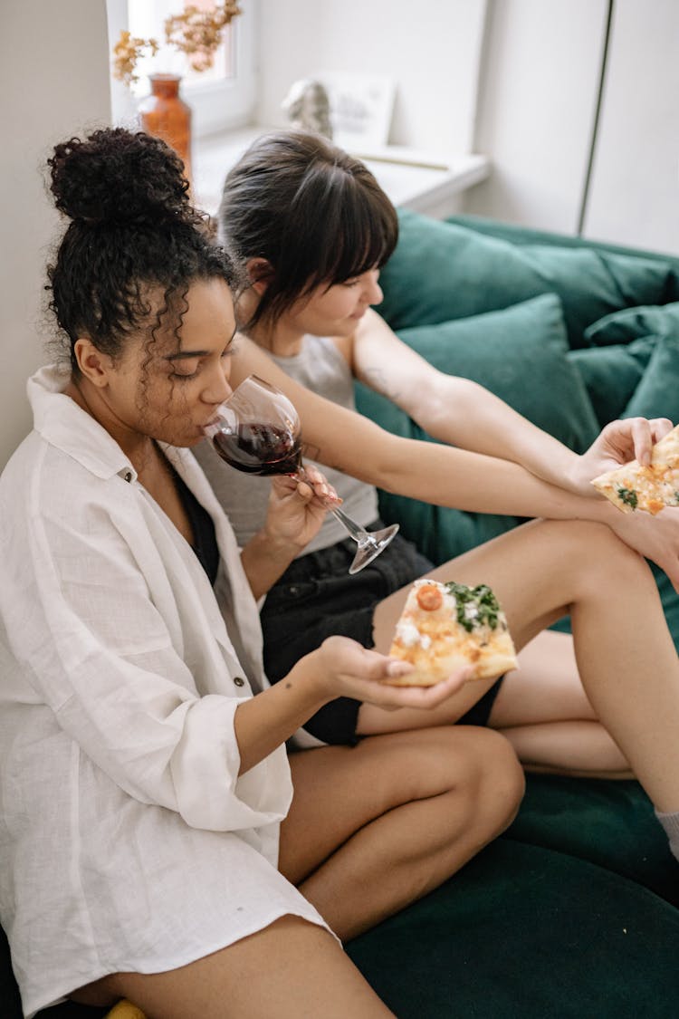 Photograph Of Women Eating Pizza