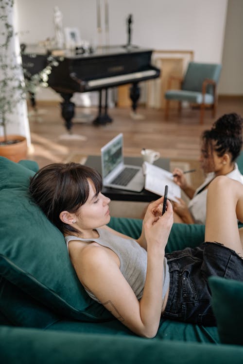 Free A Woman Lying on the Couch Stock Photo