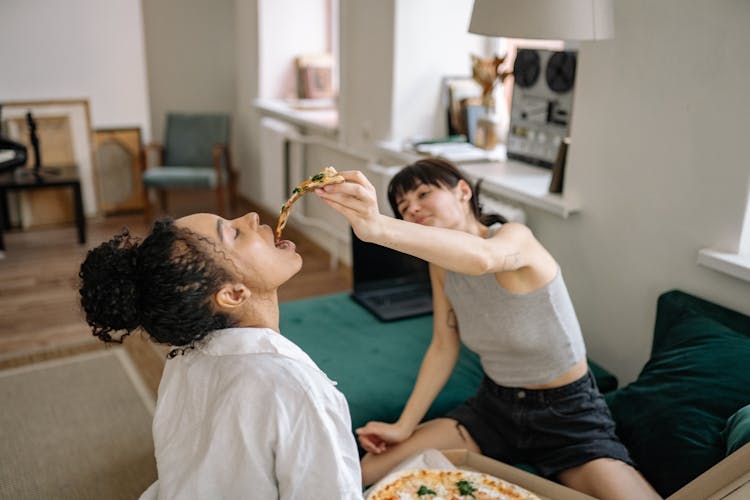 A Couple Eating Pizza