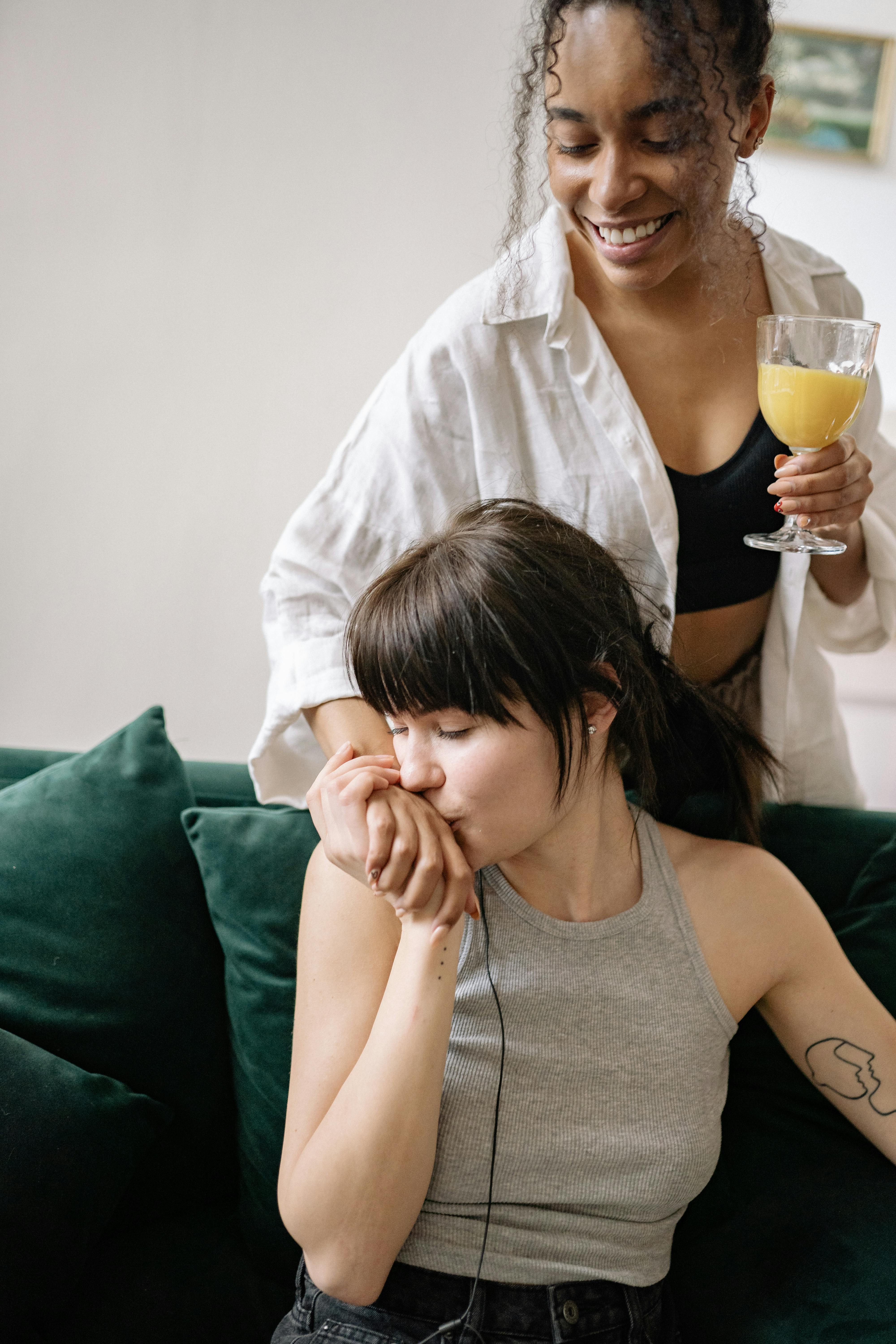 A joyful moment between a loving couple indoors enjoying each other's company.