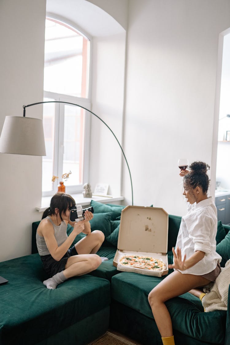 A Woman Filming Another Woman