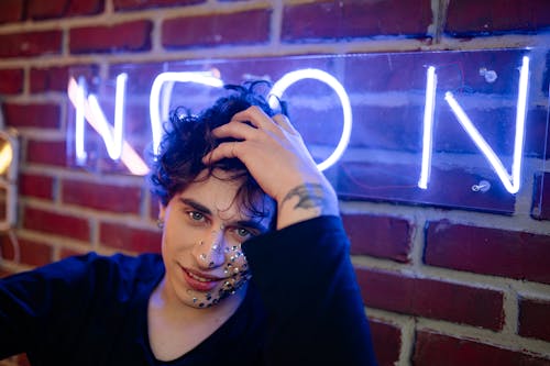 A Young Man with Silver Sequin on his Face