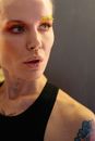 Close-up of a Woman Wearing Creative Makeup and Black Sleeveless Top
