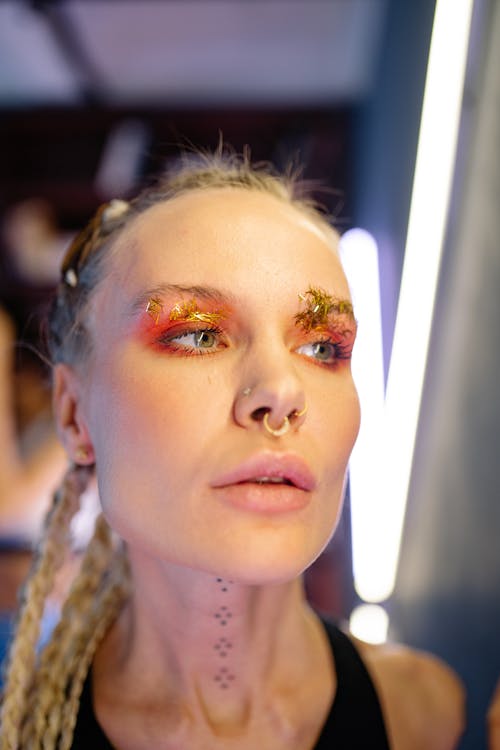 Woman in Wearing Glittery Makeup and Nose Rings