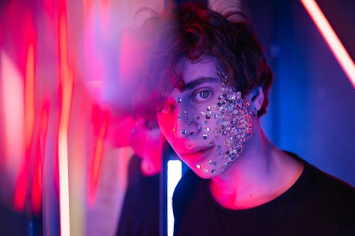 A Young Man with Silver Sequin on Face