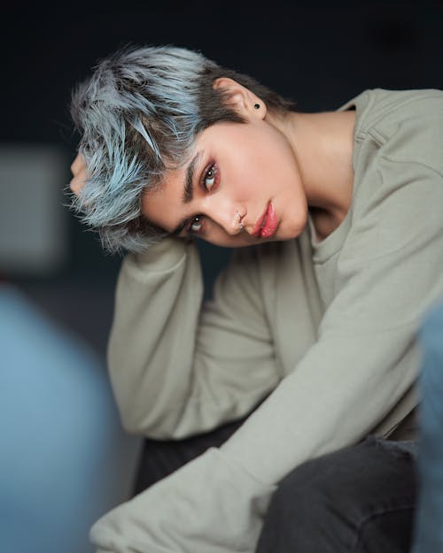 Selective Focus Photo of a Beautiful Woman in a Green Long Sleeve Shirt