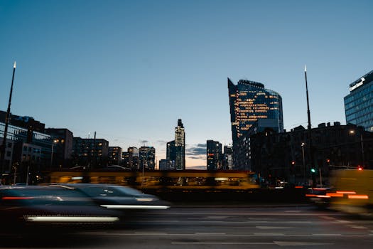 Dynamic urban skyline with skyscrapers and traffic at twilight.