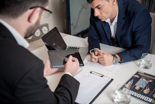 Free Men Sitting at the Table Stock Photo