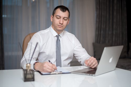 A Man Sitting at the Table