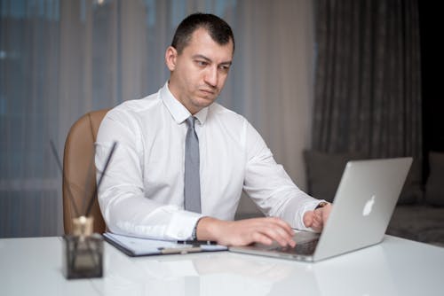 A Man Sitting at the Table