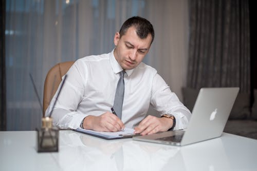 Free A Man Sitting at the Table Stock Photo
