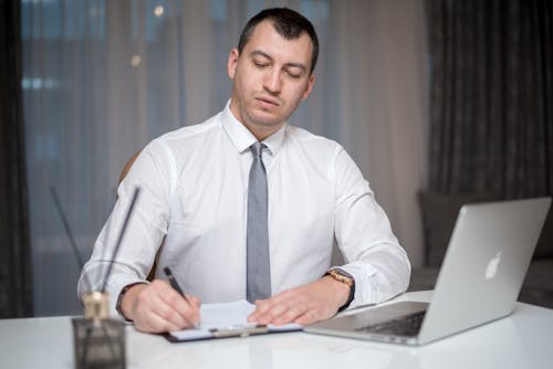 A Man Sitting at the Table