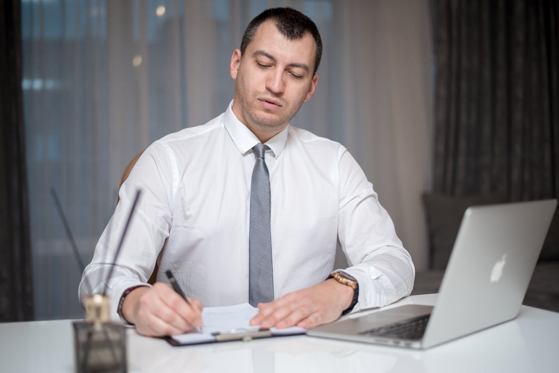 A Man Sitting at the Table · Free Stock Photo