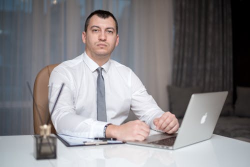 A Man Sitting at the Table