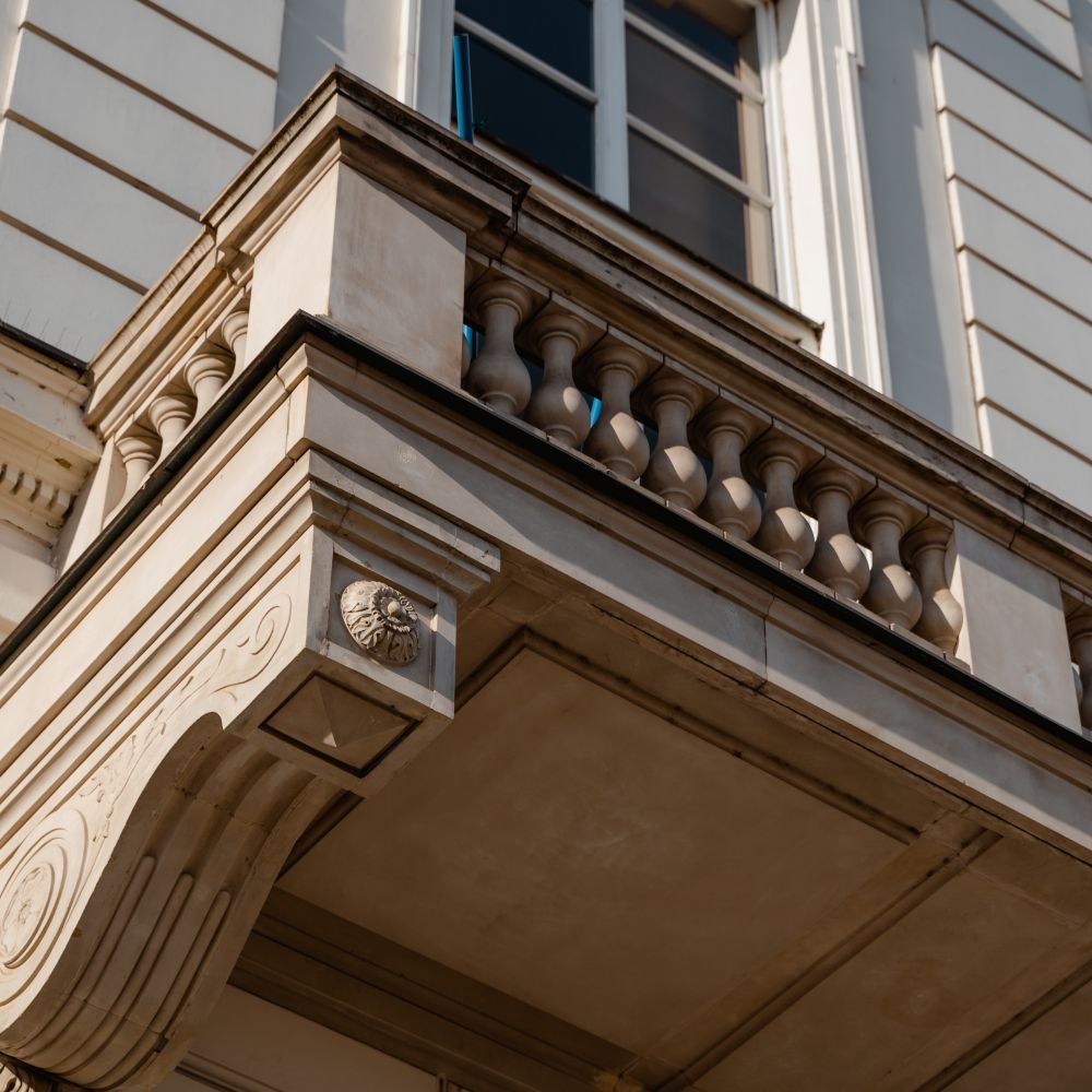 Exterior Painting in Hammersmith — a decorator at work mid-project