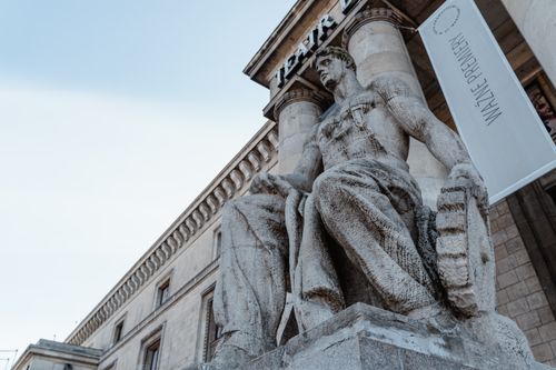 Free Low angle view of a historic stone sculpture at a theatre entrance, exemplifying Renaissance architecture. Stock Photo