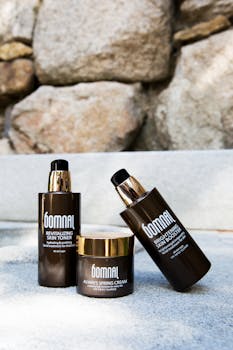 An outdoor arrangement of Bomnal skincare products showcasing revitalizing toner and brightening cream.