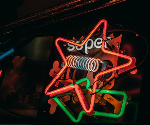 A Various Designs of Neon Lights on a Black Wall