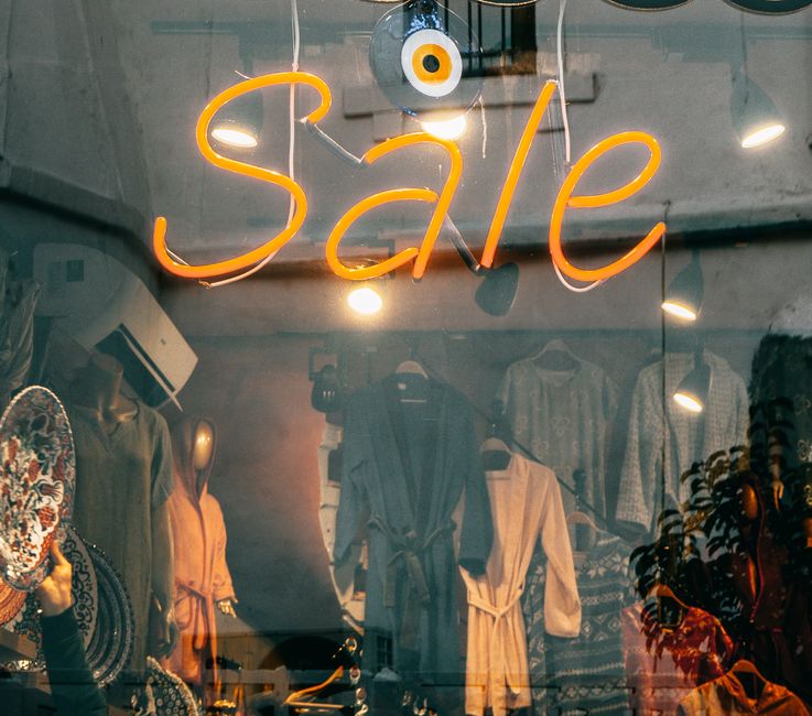 Eye-catching neon 'Sale' sign in a fashion boutique window in Istanbul, Turkey.
