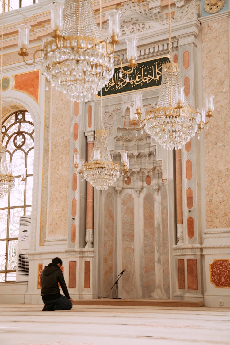 A Man Kneeling On The Floor