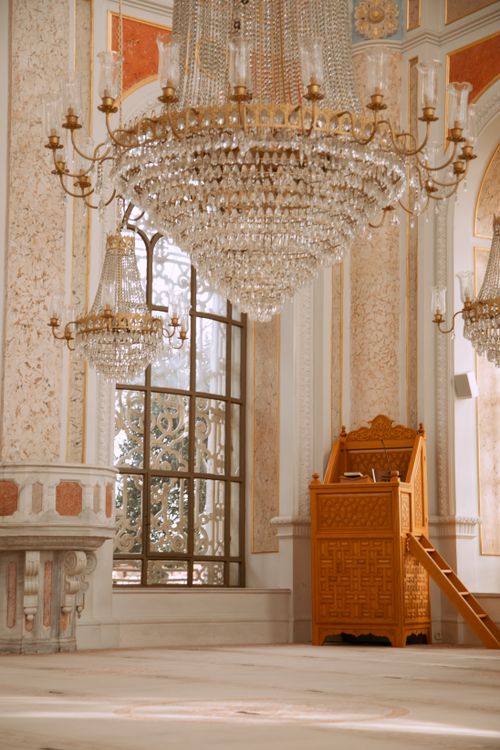 Free A stunning interior view of a historic mosque in Istanbul featuring ornate chandeliers and intricate wall art. Stock Photo