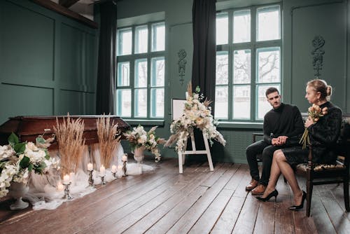 Man and Woman Sitting on the Couch