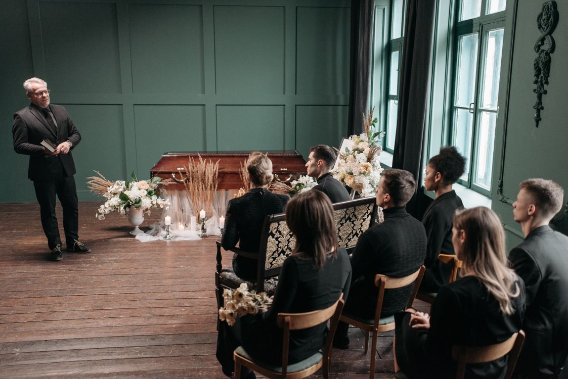 Family and friends gathered at a funeral service for a memorial ceremony