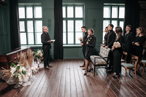 Free People Standing in Front of the Coffin Stock Photo
