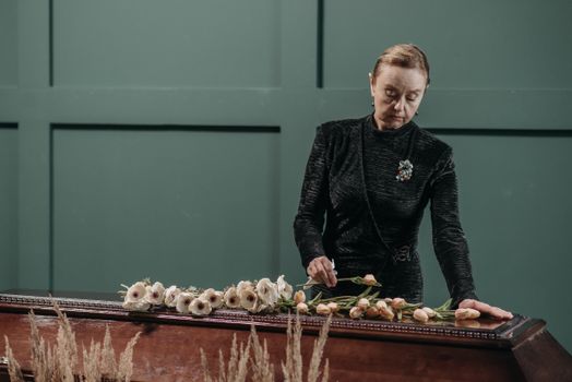 A Woman Standing Near the Coffin