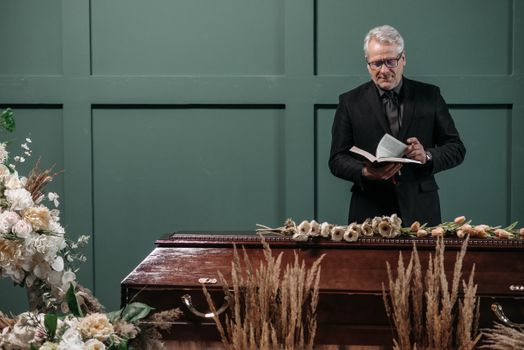 A Pastor Conducting the Funeral Service 
