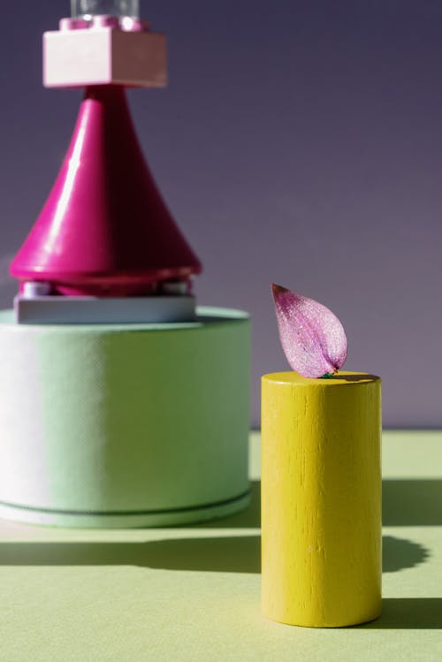 Plastic Candle Next to Color Blocks
