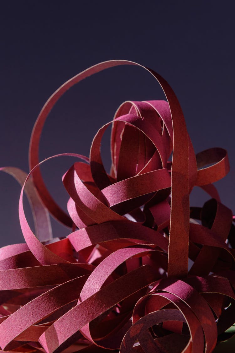 Red Paper Strips In Close Up Photography