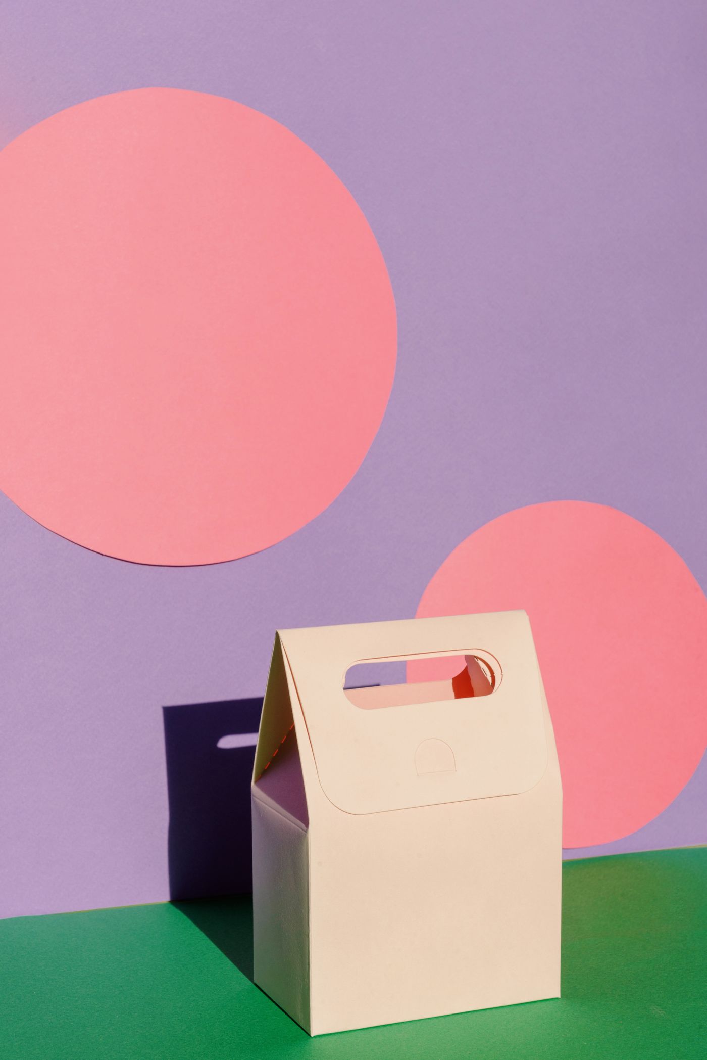Pastel carry box on a coloured backdrop