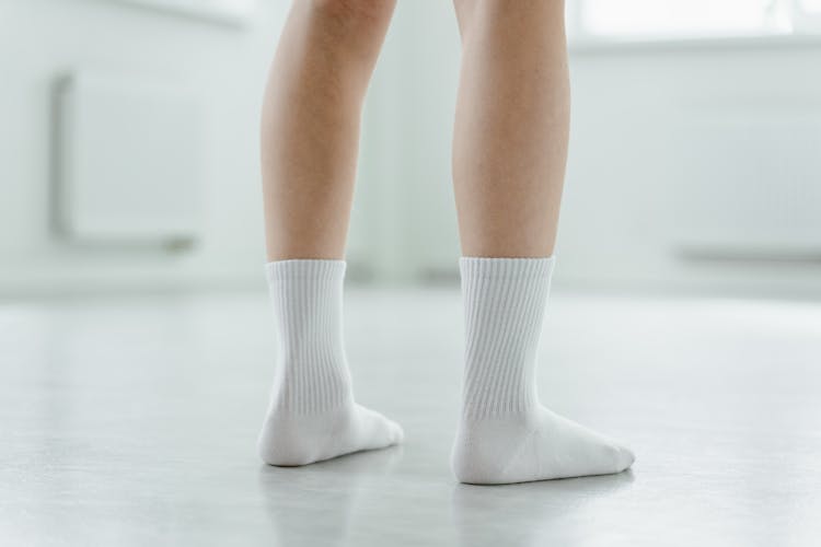 A Person In White Socks