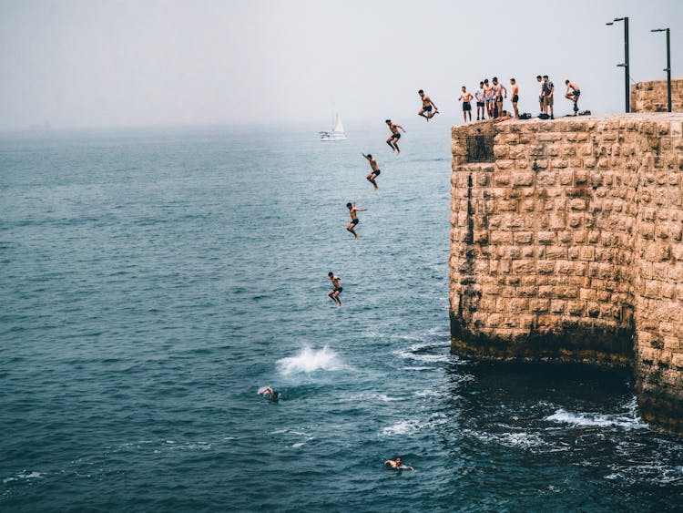 Man Jumping On Water In Sequence Shot