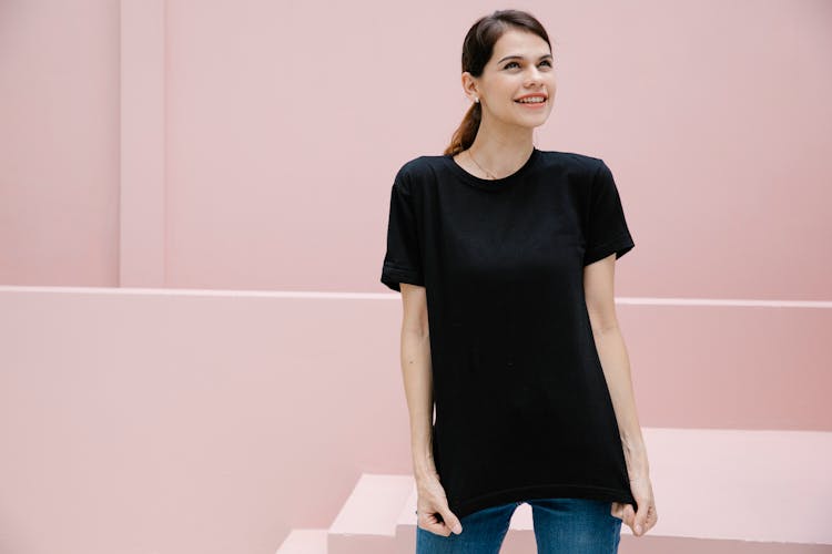 Smiling Model In Black T Shirt Against Staircase