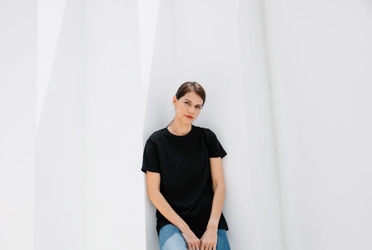 Millennial Woman In Black T Shirt On White Background