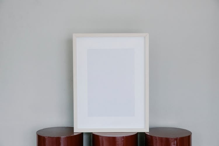 Blank Photo Frame On Blocks On Gray Background