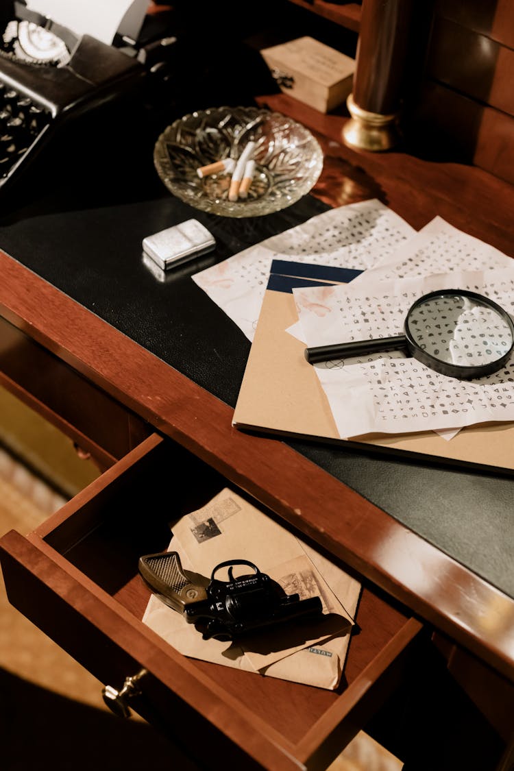 Photo Of Handgun On Wooden Shelves