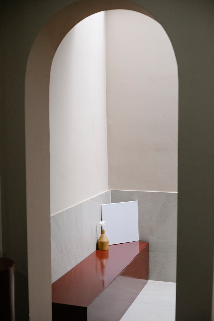 Vase With Flower And Blank Paper Placed On Wooden Bench